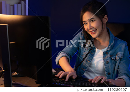 Smiling young beautiful Asian creative woman calling on phone desk. Stratagem. 119280607