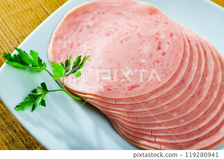 Sliced ham on wooden background 119280941