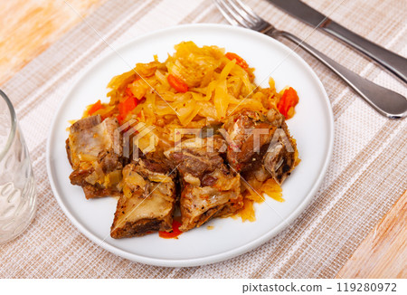 Plate of braised sauerkraut with fried pork meat Plate of braised sauerkraut with fried pork meat 119280972