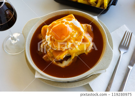 Typical portuguese sandwich like croque monsieur called Francesinha with cheese and steak Typical portuguese sandwich like croque monsieur called Francesinha with cheese and steak 119280975