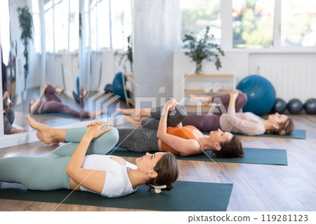 Group of women doing stretching in studio 119281123