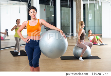 Woman with fitness ball 119281236