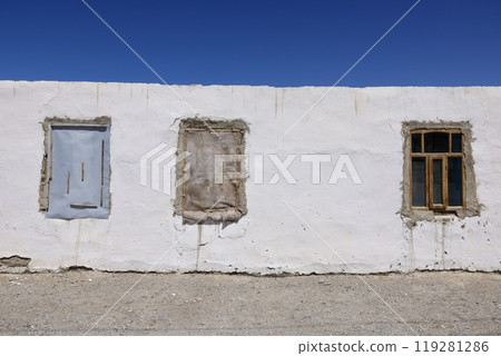 White walls, blue sky and unusual window frames White walls, blue sky and unusual window frames 119281286