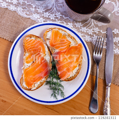 Sandwich with salmon served on platter Sandwich with salmon served on platter 119281311