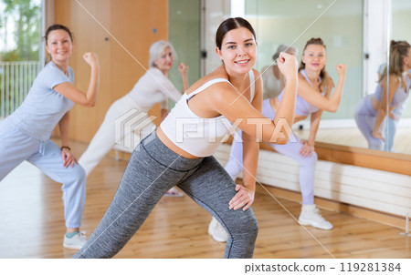 Active people practicing lindy hop movements in dance class 119281384