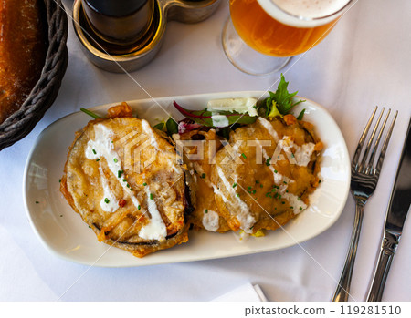 Aubergine fried in batter with yogurt sauce 119281510