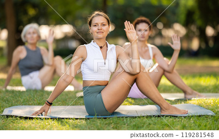 Young woman doing yoga in park Young woman doing yoga in park 119281548