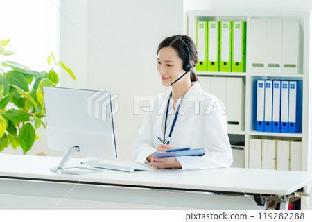 A medical professional operator wearing a white coat A medical professional operator wearing a white coat 119282288