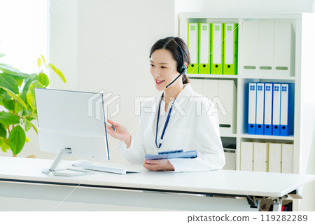 A medical professional operator wearing a white coat 119282289