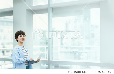 A young lady who operates a personal computer A young lady who operates a personal computer 119282459