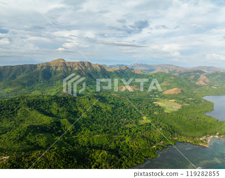 Aerial view of Mountains covered rainforest and trees. Blue sky with clouds. Coron, Palawan. Philippines. Aerial view of Mountains covered rainforest and trees. Blue sky with clouds. Coron, Palawan. Philippines. 119282855