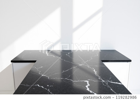 White walls and black marble counters lit by natural light White walls and black marble counters lit by natural light 119282986