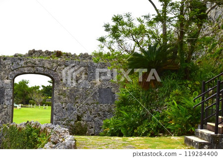 Arch gate and cycad at Nakagusuku Castle ruins Arch gate and cycad at Nakagusuku Castle ruins 119284400