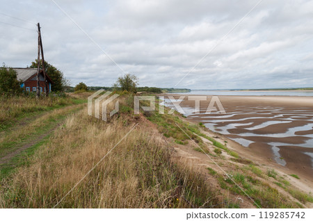 Northern Dvina River with large sandy beach 119285742