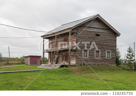 Log barn in northern russian village 119285750