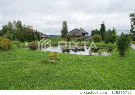 Small pond, surrounded by stones 119285752