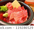 Bowl of rice topped with sashimi  119286529
