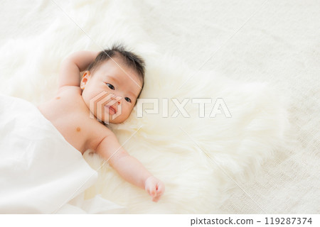 Baby wrapped in white cloth Baby wrapped in white cloth 119287374