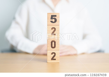 2025 year calendar block on table. goal, Resolution, strategy, plan, start, budget, mission, action, motivation and New Year concepts 119287439