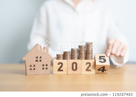 2024 end year to Happy New Year 2025 with house model and Coins stack. real estate, Home loan, tax, investment, mortgage, financial, savings and New Year Resolution concepts 2024 end year to Happy New Year 2025 with house model and Coins stack. real estate, Home loan, tax, investment, mortgage, financial, savings and New Year Resolution concepts 119287483
