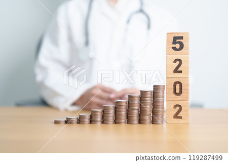 Happy New Year 2025 with Doctor and coins stack. Money stack Counting arrangement for deposit, Healthcare cost, Money Saving, Health Insurance, Medical, Donation and Financial concept 119287499