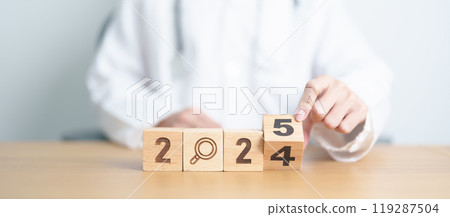 2024 end year to Happy New Year 2025 with Smile block against doctor. Health, Healthcare insurance, medical Satisfaction, feedback, Review, mental health, wellbeing, wellness and good year concept 119287504
