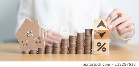 Arrow change to UP and Down with percentage, Home model and money coins stack. Real estate Mortgage, Refinance, House loan and debt, Interest rate, Insurance, Financial and Property Tax concepts Arrow change to UP and Down with percentage, Home model and money coins stack. Real estate Mortgage, Refinance, House loan and debt, Interest rate, Insurance, Financial and Property Tax concepts 119287638