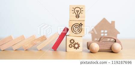 wood block falling to business icon with Home and Car model. Real estate Mortgage, House loan and Car debt, Interest rate, risk management, Insurance and economic recession 119287696