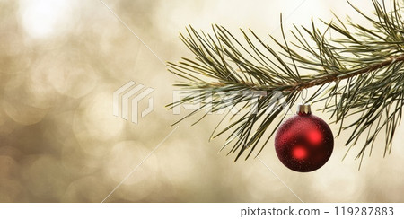 Festive pine branch with red ornament on neutral background for holiday decor design Festive pine branch with red ornament on neutral background for holiday decor design 119287883