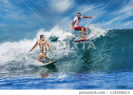 Two male surfers on a blue wave Two male surfers on a blue wave 119288023