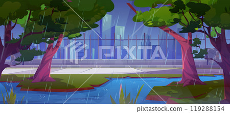 Rainy weather in city park with pond and fence 119288154