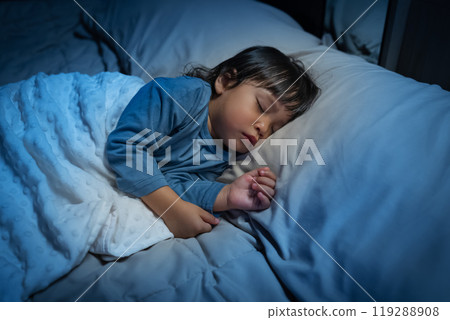 toddler baby sleeping on bed at night 119288908