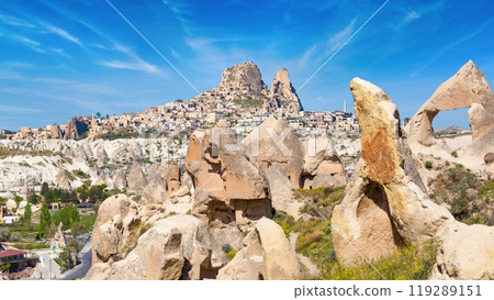 Hand carved rooms in limestone rocks and castle of Uchisar in Cappadocia, Turkey. 119289151