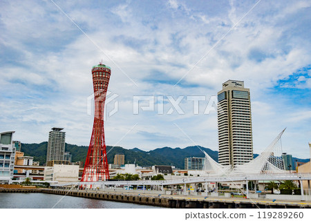 Port Tower and Kobe Maritime Museum in Meriken Park seen from a sightseeing boat on a clear day in Kobe Port Port Tower and Kobe Maritime Museum in Meriken Park seen from a sightseeing boat on a clear day in Kobe Port 119289260
