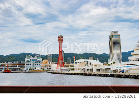 Port Tower and Kobe Maritime Museum in Meriken Park seen from a sightseeing boat on a clear day in Kobe Port 119289261