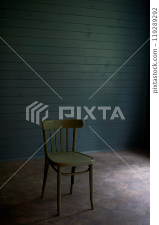 Wooden chair in an empty room, loneliness and minimalism. Room d cor. 119289292