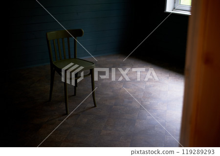 Wooden chair in an empty room, loneliness and minimalism. Room d cor. 119289293