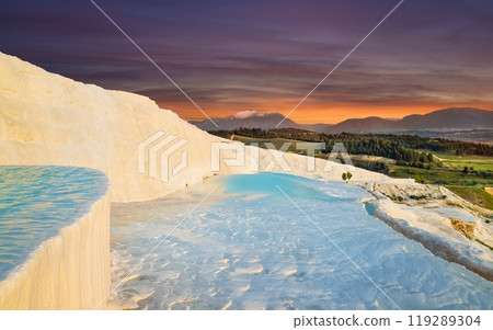 Sunset view of amazing Pamukkale. Travertine terrace formations with flowing thermal springs in Pamukkale most visited attraction in Turkey. Sunset view of amazing Pamukkale. Travertine terrace formations with flowing thermal springs in Pamukkale most visited attraction in Turkey. 119289304