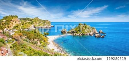 Beautiful Isola Bella, small island near Taormina, Sicily, Italy. Narrow path connects island to mainland Taormina beach surrounded by azure waters of Ionian Sea. Beautiful Isola Bella, small island near Taormina, Sicily, Italy. Narrow path connects island to mainland Taormina beach surrounded by azure waters of Ionian Sea. 119289319