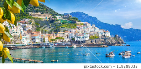 Panoramic view of beautiful Amalfi on hills leading down to coast, Campania, Italy. Amalfi coast is most popular travel and holiday destination in Europe. Panoramic view of beautiful Amalfi on hills leading down to coast, Campania, Italy. Amalfi coast is most popular travel and holiday destination in Europe. 119289332