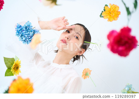 A woman surrounded by colorful flowers - fantasy 119289397
