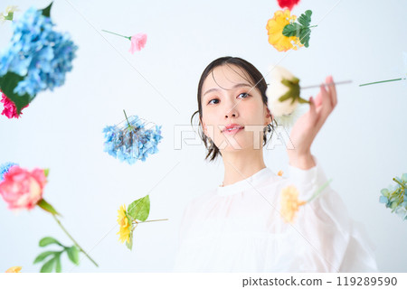 A woman surrounded by colorful flowers - fantasy 119289590