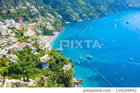 Beautiful Positano on hills leading down to coast and azure sea on Amalfi Coast in Campania, Italy. Amalfi coast is most popular travel and holiday destination in Europe. Beautiful Positano on hills leading down to coast and azure sea on Amalfi Coast in Campania, Italy. Amalfi coast is most popular travel and holiday destination in Europe. 119289942