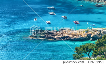 Marina Piccola with rocky shore and clear blue sea, Capri Island, Italy. Marina Piccola with rocky shore and clear blue sea, Capri Island, Italy. 119289959