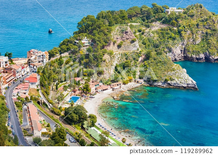 Clear blue sea, comfortable hotels and beach near Isola Bella in Taormina, Sicily, Italy 119289962