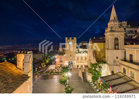 Night aerial view of Square Piazza IX Aprile with San Giuseppe church and Clock Tower in Taormina, Sicily, Italy. 119289971
