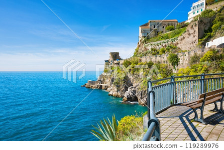 Rocky coast and clear blue sea next to beautiful Amalfi, Campania, Italy. Amalfi coast is most popular travel and holiday destination in Europe. 119289976