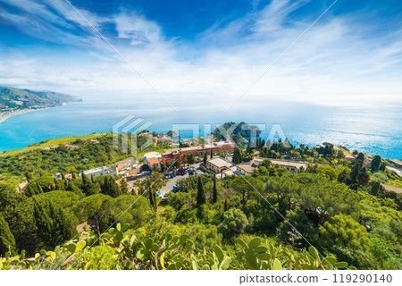 Aerial view of Taormina resort town located in Metropolitan City of Messina, on east coast of Sicily island, Italy. Aerial view of Taormina resort town located in Metropolitan City of Messina, on east coast of Sicily island, Italy. 119290140
