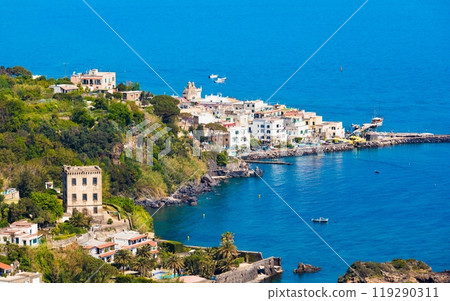 Ischia Ponte bordering waters of Bay of Cartaromana and Guevara Tower on Ischia Island, Italy. 119290311