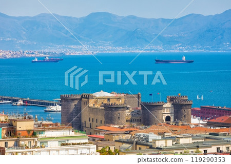 Castel Nuovo towering over neighboring houses in Naples and Bay of Naples, Italy. Castel Nuovo towering over neighboring houses in Naples and Bay of Naples, Italy. 119290353